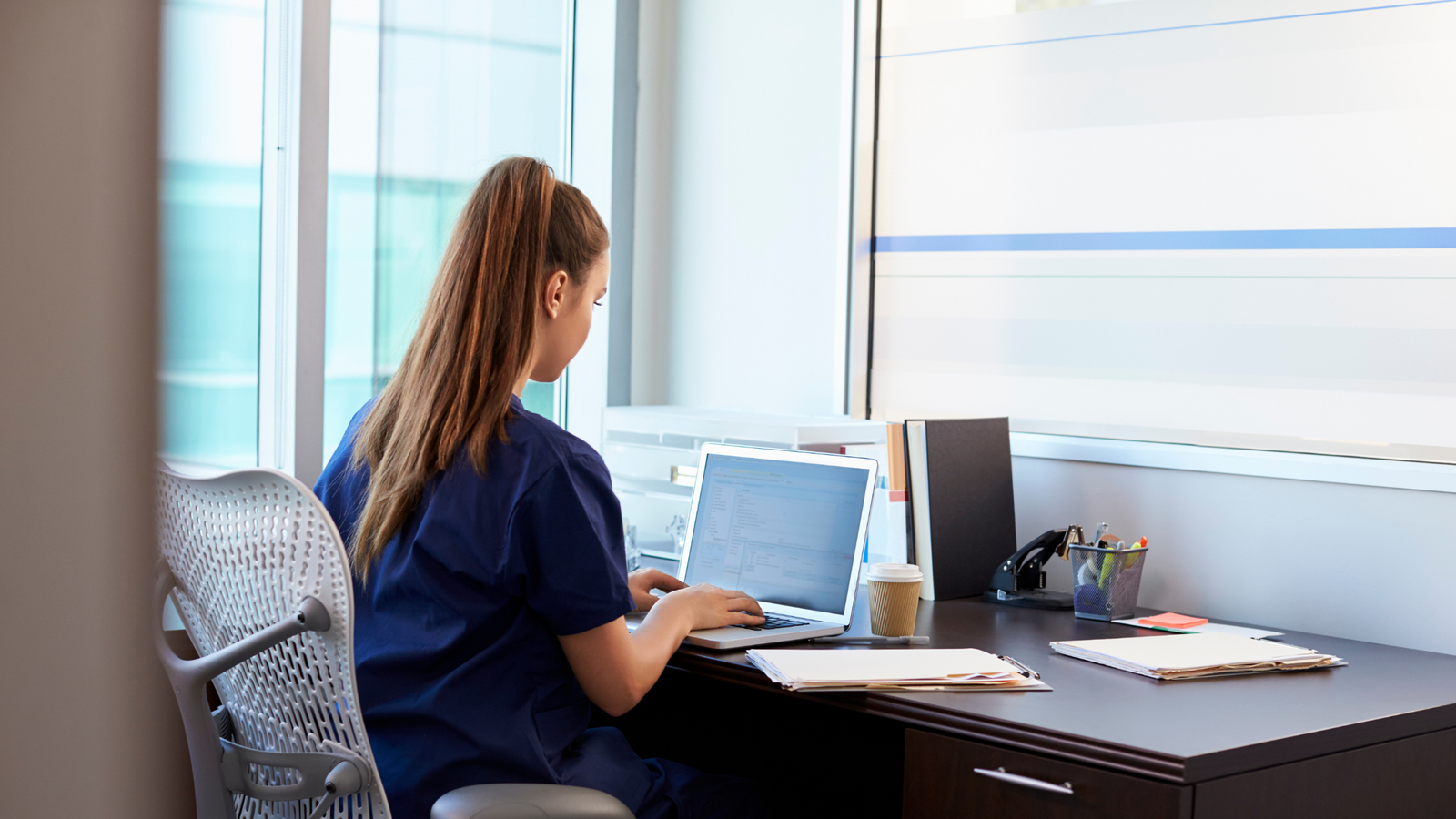 Nurse entrepreneur reviewing nursing business structure options.